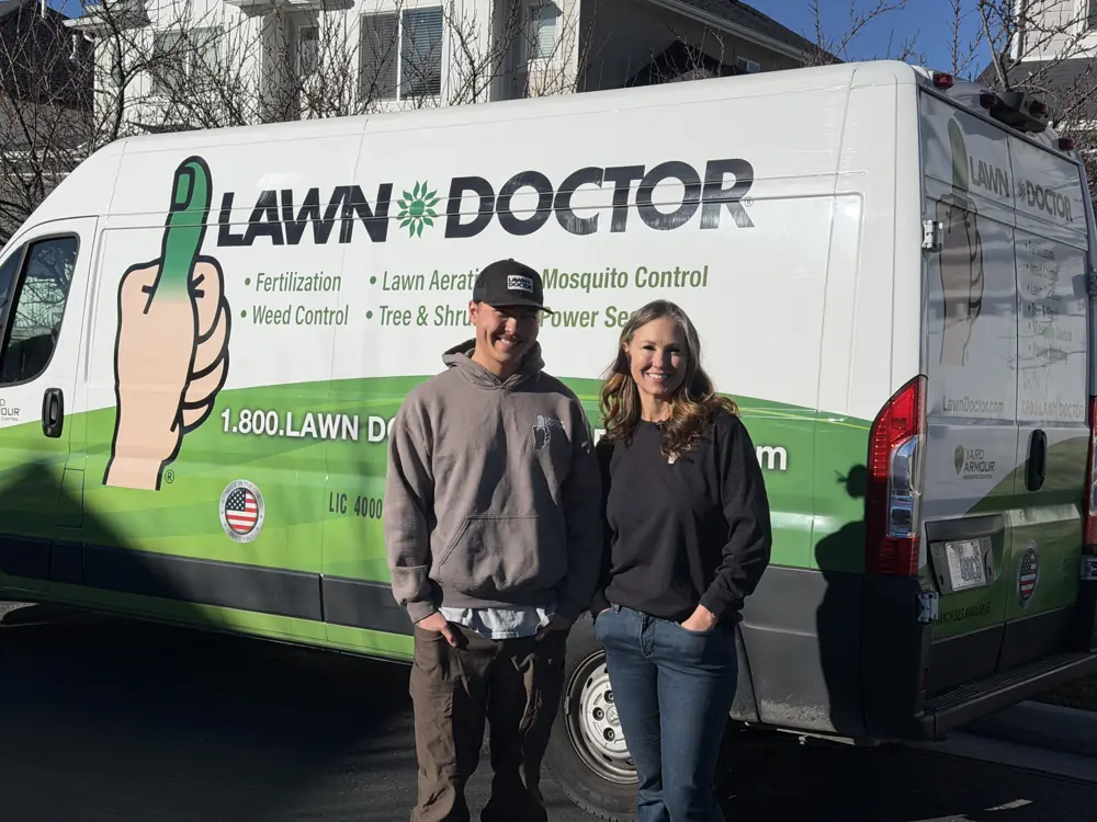 Your local Lawn Doctor team in front of a service van